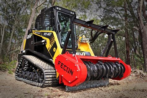 t550 skid steer running a ground mulcher|forestry mulcher attachment.